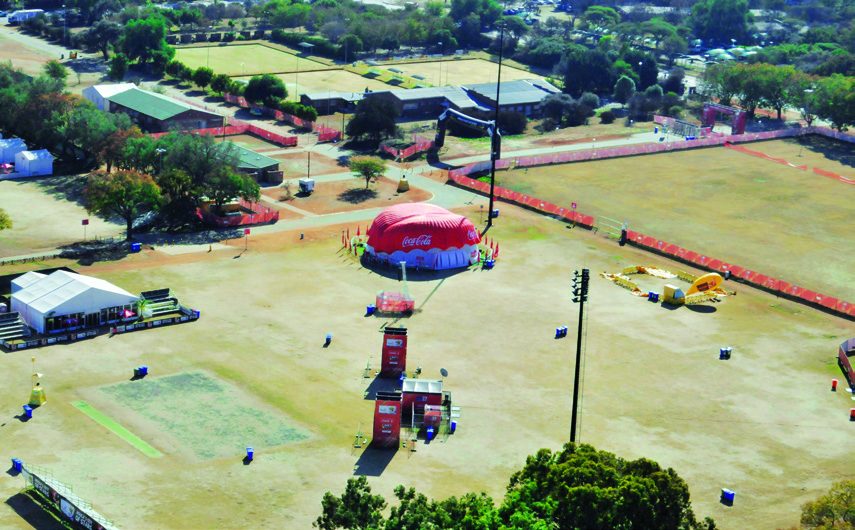 Aerial view of the fan park with marquees, a red dome structure and a stage.